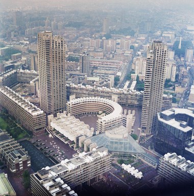 A colour photo of the Barbican arts centre in the centre from a high vantage point.