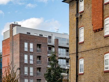 View of part of an urban housing redevelopment showing old and new elements.