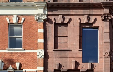 Details of windows and dressings to a reinstated Victorian-style facade and adjacent building.