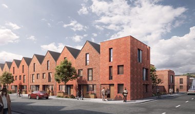 An image of a modern brick terrace of three-storey houses with saw tooth roofs gable side on to the street; the end building has a flat roof.