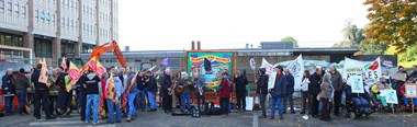 A large group pf people with banners