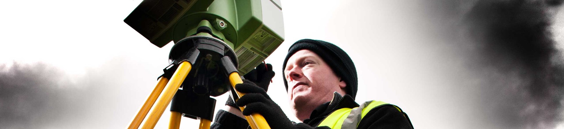 A man using laser scanning equipment at Stonehenge.