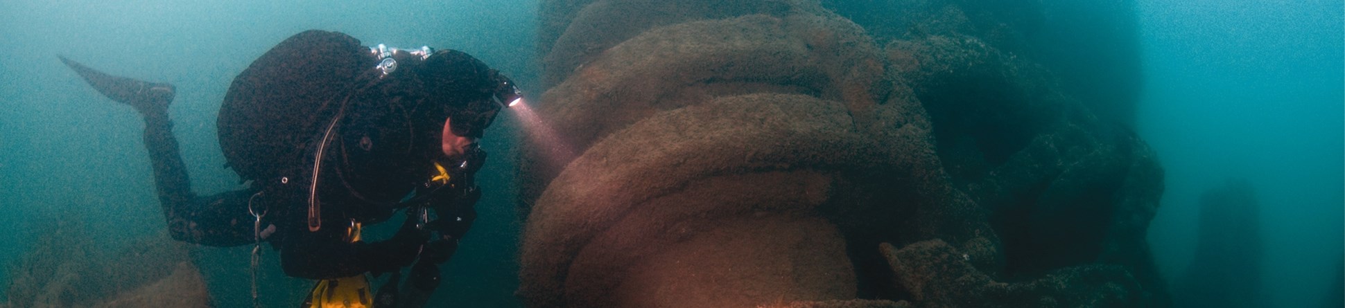 A diver examines the anchor winch of the War Knight on the sea bed.