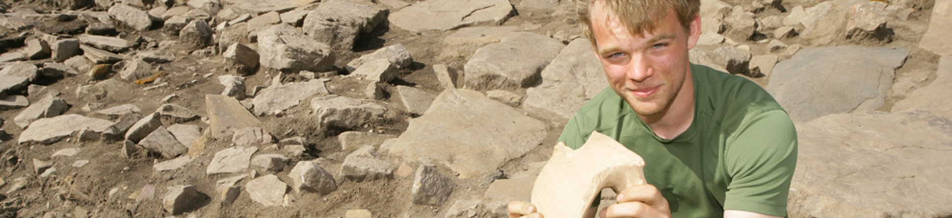 Young man holding an artefact