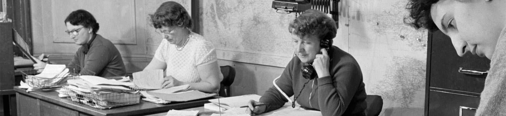 Black and white photo of women working in an office, 1956.