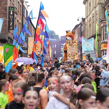 A crowd at a street carnival in Wigan.