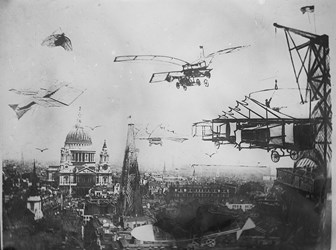 Archive black and white photograph showing a city with a domed cathedral and other towers.