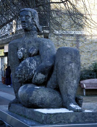 Sculpture of woman holding a fish