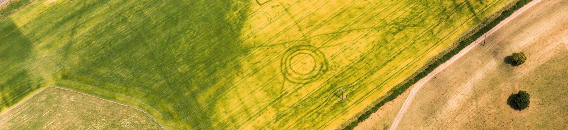 Aerial view of Bronze Age burial mound and prehistoric pit alignment