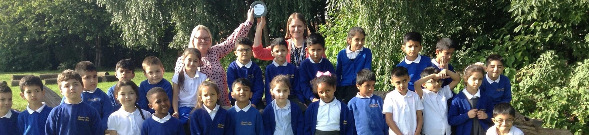 Teachers and pupils from Breckon Hill Primary School in Middlesbrough with their Champion Heritage School Award