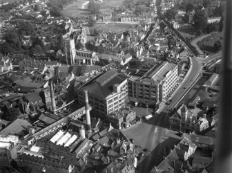 A black and white aerial photograph of a factory building in Calne, Wiltshire.