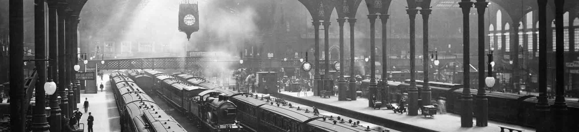 Black and white photo of the train shed at Liverpool Street Station