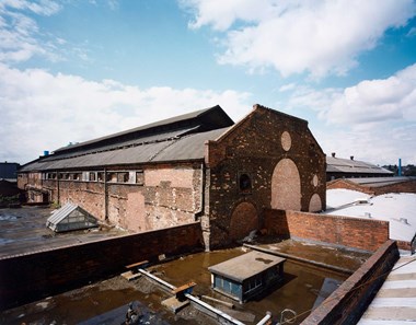 The east gable and south elevation of the main foundry building