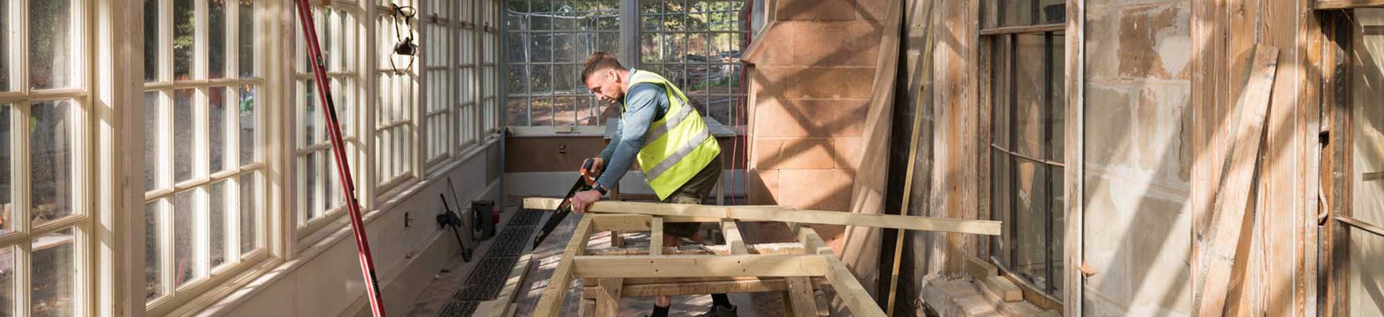 The Charterhouse, London Road, Coventry, West Midlands. Portrait of carpenter/contractor working on site.